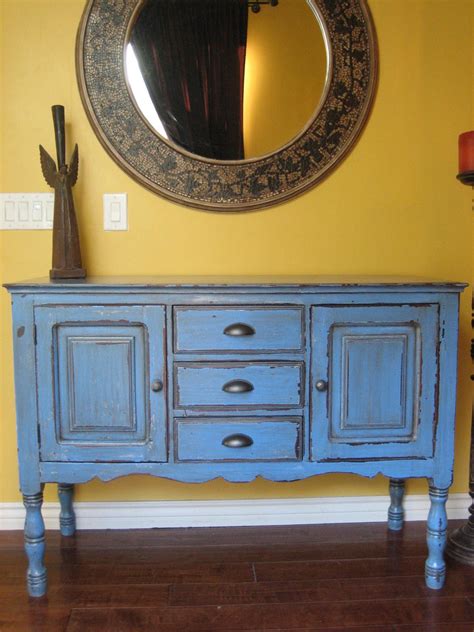 Top has been stripped and re finished and all hardware has been touched with a copper tone finish. European Paint Finishes: ~ Rustic Blue Buffet