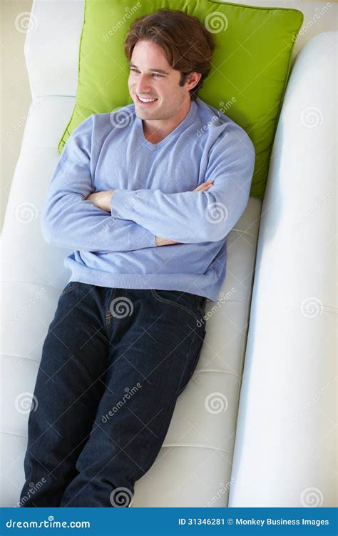 Overhead View Of Man Relaxing On Sofa Stock Image Image Of Twenties