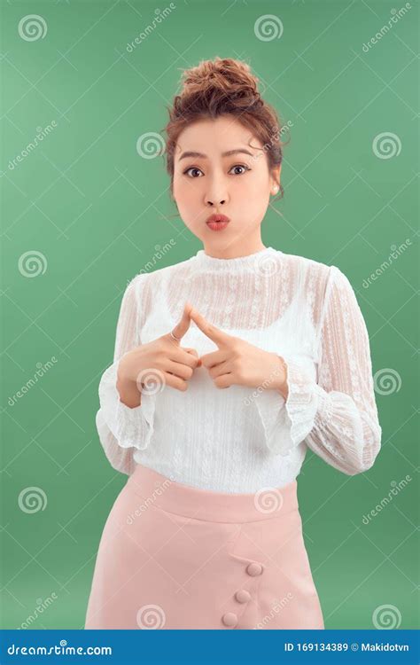 Lovely Asian Girl Posing Isolated Over Green Background Stock Image