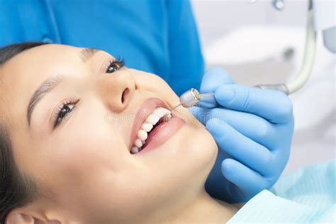 Young Female Patient With Pretty Smile Examining Dental Inspection At