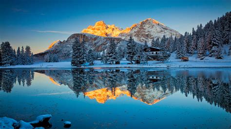 snow covered pine trees  yellow covered mountains reflection  lake  nature hd desktop