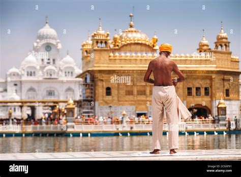 Sikh Pilgrim Prepearing To Immerse In Holy Tank Near Golden Temple Sri