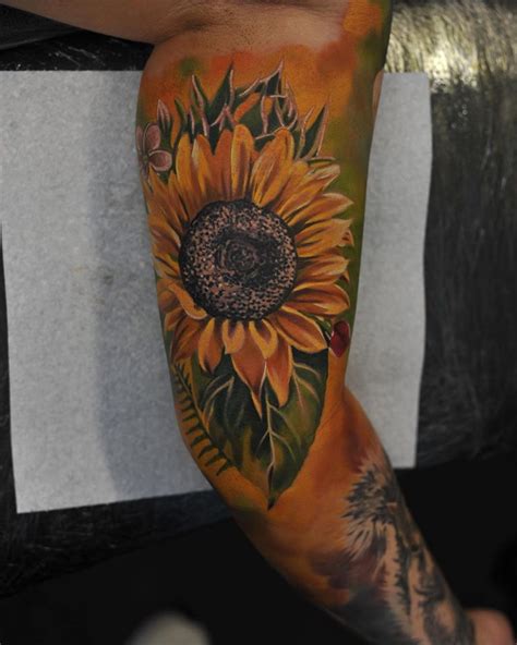 Maybe you would like to learn more about one of these? Colorful Sunflower tattoo on arm by Radu Rusu ...