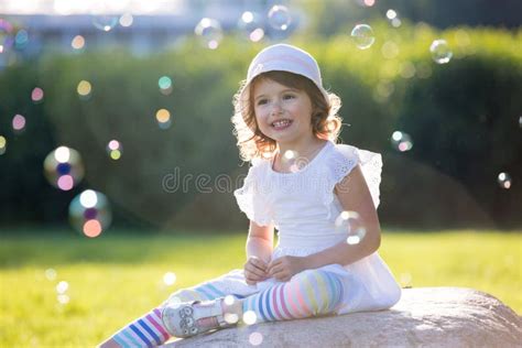 Adorable Little Girl Has Happy Fun With Cheerful Smiling Face Stock