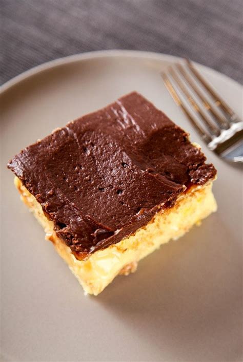 Boston cream poke cake.yellow buttery cake filled with a french vanilla cream pudding and frosted with rich chocolate ganache frosting. Boston Cream Poke Cake