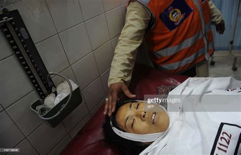 The Dead Body Of A Chinese Woman Is Seen At A Hospital In Peshawar On