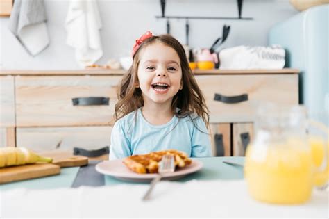 Free Photo Little Girl Having Her Breakfast