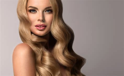 Blonde Girl With Long And Volume Shiny Wavy Hair Beautiful Woman
