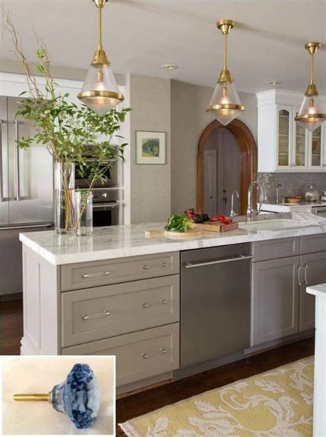 Elegant white kitchen with dark wooden flooring. Dark, light, oak, maple, cherry cabinetry and light wood ...