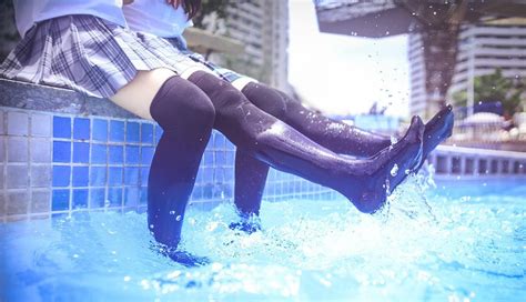 two japanese school girls wet themselves in the pool alice wetlook