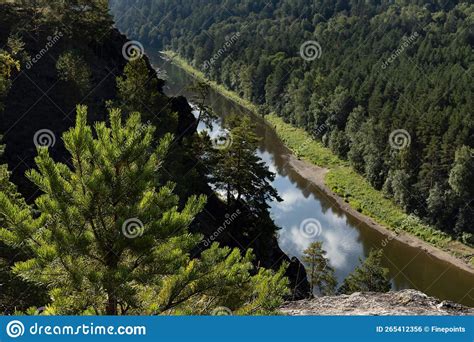 Bright Summer Landscape With Thin Blue River In Canyon And Lush Green