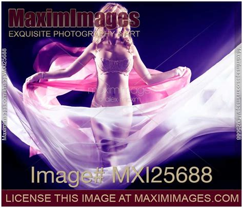 Photo Of Woman Surrounded By Flying Fabrics Stock Image MXI