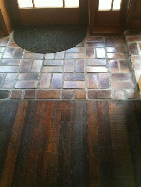 Most hardwood flooring stores sell t shaped molding that installs between the last board and the tiles. Awesome Tile Entryway With Wood Floor - best 25 ...