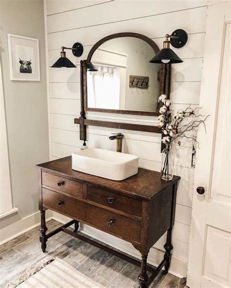 A round backplate, curved shades, and trendy seeded glass give this fixture gentle flare perfect for adding an understated touch of style. Stunning Farmhouse Bathroom Vanity Decor Ideas