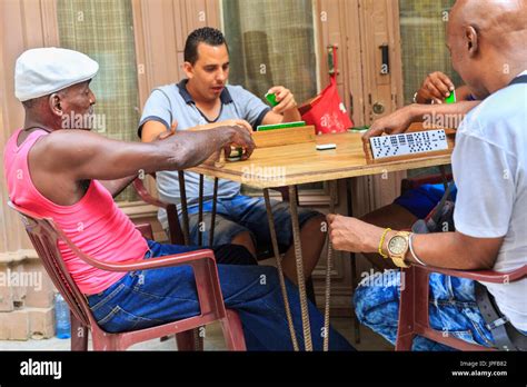 Group Of Cuban Men Play A Game Of Dominoes In The Street Old Havana