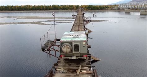 Car Crossing Scary Vitim Bridge On Bam Road In Siberia Video Thrillist