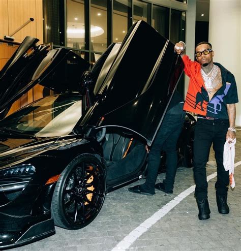 Tory Lanez Continues To Pose Sitting On His Cars This Time On His