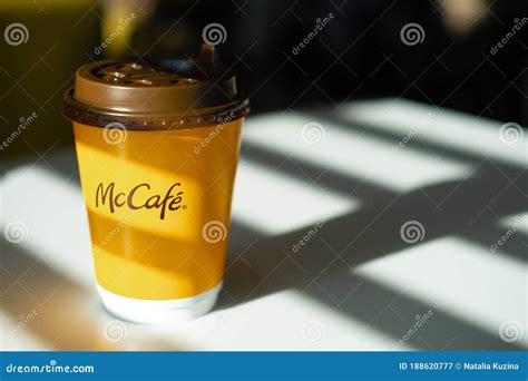 Mccafe Menu At Mcdonalds Restaurant Yellow Cup Of Coffee On A Table Outdoors With Yellow