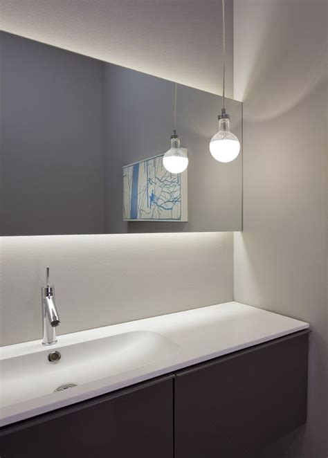 Floating ceiling panels can be customized, making them a versatile design element that can designate certain spaces, direct the flow of traffic, enhance acoustic performance, add lighting, and more. Chic Led Light Strips technique Chicago Modern Powder Room ...