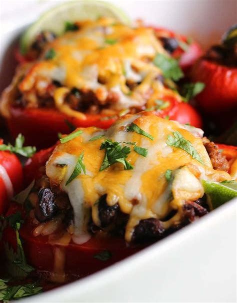 mexican stuffed peppers ~ seasoned ground beef rice and black beans topped with cheese and bak