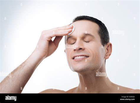 Nice Delighted Man Closing His Eyes Stock Photo Alamy