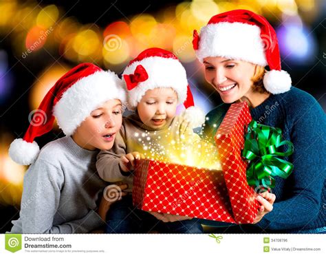 No matter the holiday, shopping for a unique gift for a child is easy at findgift. Mother With Children Opens The Box With Gifts On The ...