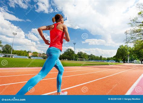 Athletic Woman Running On Stadiums Track In Summer Stock Photo Image