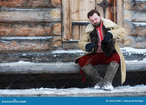 Traditional Winter Costume Of Peasant Medieval Age In Russia Stock