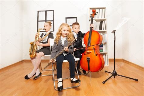 Happy Kids Playing Musical Instruments — Stock Photo © Serrnovik 77369820