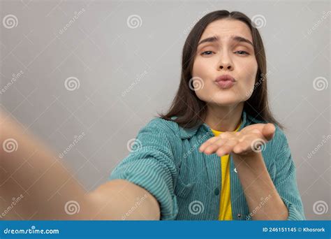 woman making point of view photo sending air kissing pov expressing love and gentle stock
