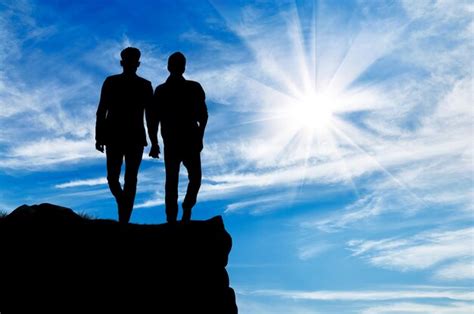 Premium Photo Silhouette Of Two Gay Men Walking Holding Hands On Top