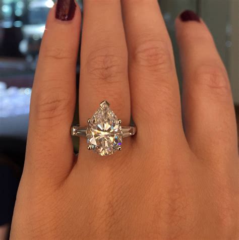 In this engagement ring, a 1 carat (ct) round center stone is given a boost of additional sparkle by the 0.50 carats of melee set in the halo and shank. 15 Best Collection of 2 Carat Pear Shaped Engagement Rings