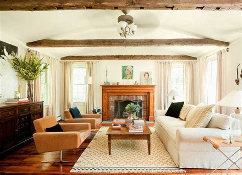 Rustic white painted beams in the ceiling of this living room designed by martyn lawrence bullard is softened up by the crystal chandelier. SEE THIS HOUSE: WEEKEND COUNTRY CHIC! | Nbaynadamas ...
