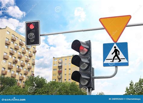 Different Road Signs And Traffic Lights On City Street Stock Image