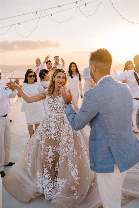 An All White Wedding Set Against The Santorini Sunset Wedded Wonderland