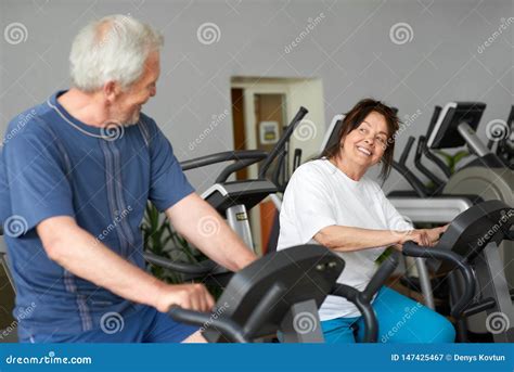 Beautiful Couple Of Seniors Working Out At Gym Stock Image Image Of