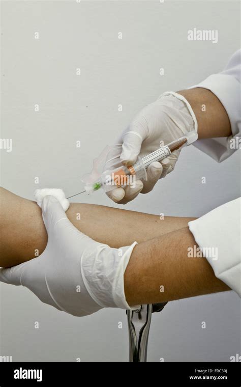 Nurse Collecting Blood From Patient Stock Photo Alamy