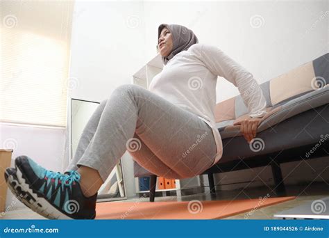 Asian Muslim Woman Wearing Hijab Doing Exercise At Home Keep Healthy