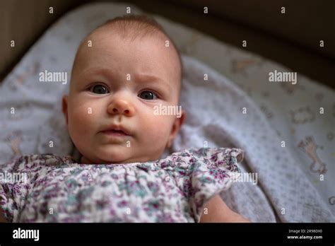 Portrait Of Little Baby Girl Lying On The Sofa Stock Photo Alamy