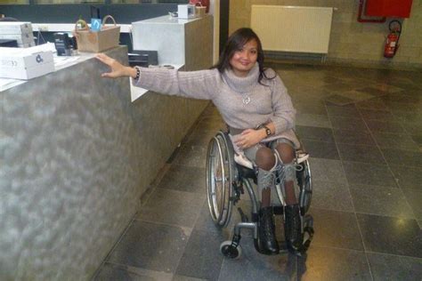 Woman In Wheelchair With Legbraces