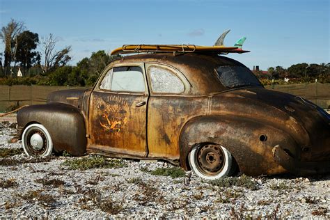 Vintage Rusty Broken Car On Gravel · Free Stock Photo
