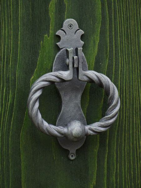 A Metal Handle On A Wooden Door