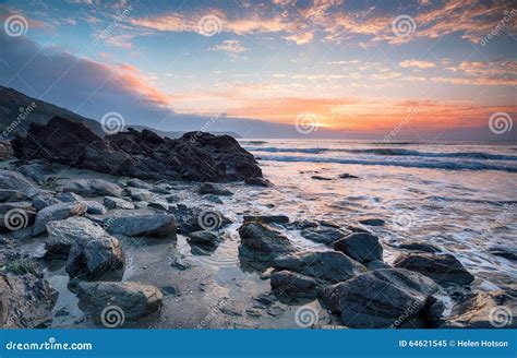 Beautiful Sunrise Over A Rocky Beach Stock Image Image Of Beautiful