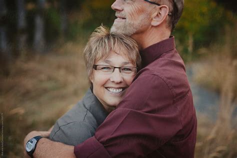 Middle Aged Woman Enjoying A Hug From Her Husband Porrob And Julia Campbell