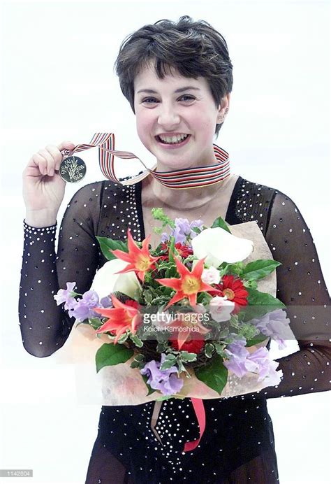 Russias Irina Slutskaya Shows Off Her Gold Medal During The Victory