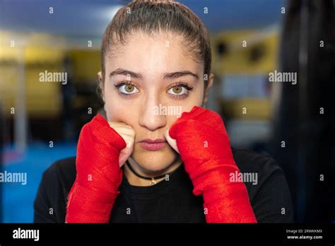 Close Up Female Boxer Portrait In Guard Position In A Boxing Ring