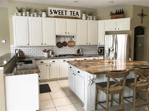 White kitchen cabinets with stove and hood. 9 Ways to Decorate Above Your Kitchen Cabinets
