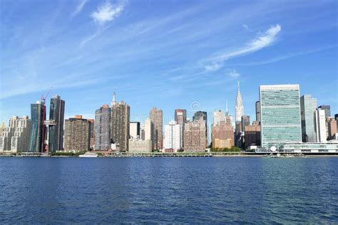 New York City Waterfront East River And Manhattan Skyline On A Sunny