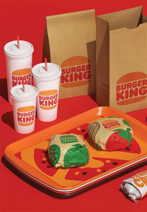 Burger Kings Breakfast Items Are Displayed On An Orange Tray With Cups And Napkins