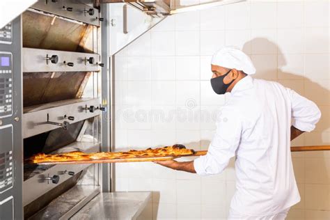 Man Taking Baked Loaf Bread Out Oven Stock Photos Free And Royalty Free